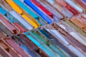Close-up view of colorful oil pastels arranged for artistic use.